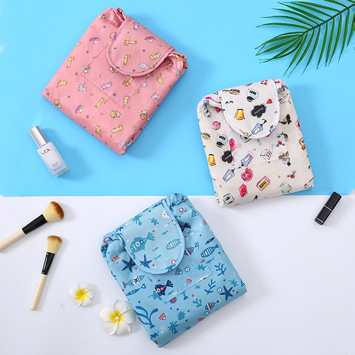 Compact women's drawstring makeup bag, ideal for travel & gym.