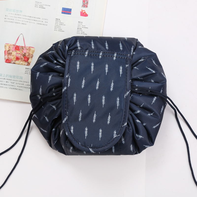 Women's foldable cosmetic travel bag with secure drawstring closure.