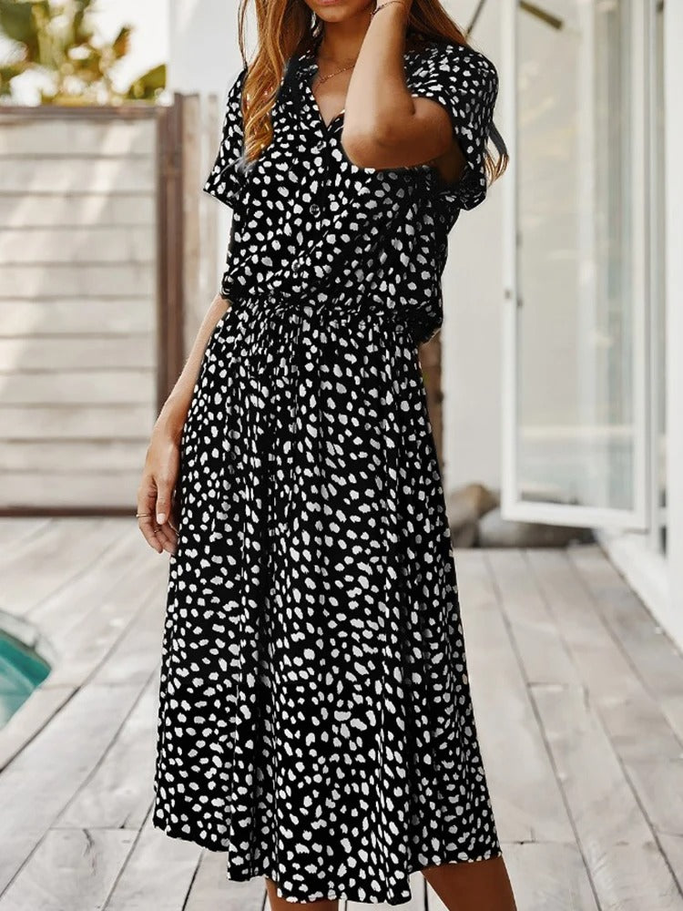 Simple yet elegant women's printed midi dress, short sleeves & adjustable waist for effortless style.