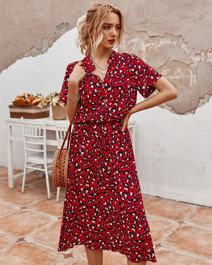 Elegant women's printed midi dress, short sleeve design with a flattering adjustable waist.
