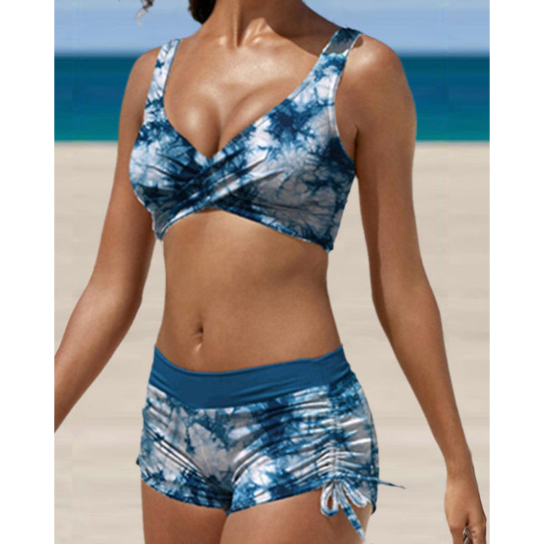 Stylish women's printed bikini, adjustable straps & removable pads, ideal for summer beachwear