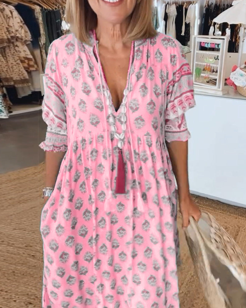 Women's V-neck midi dress with attractive print, sleeveless, for casual elegance