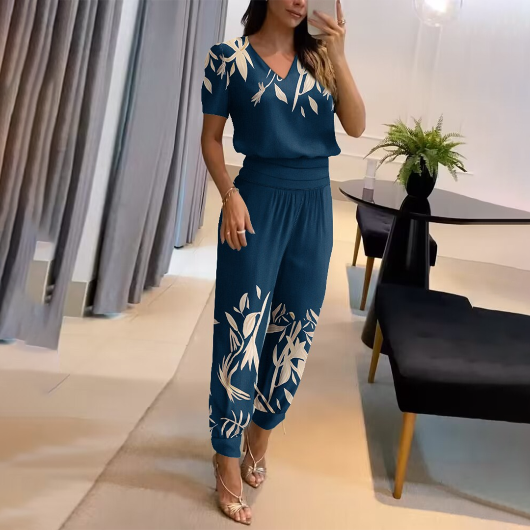 Elegant women's printed wide leg jumpsuit with V-neck, ideal for casual yet stylish summer outfits.