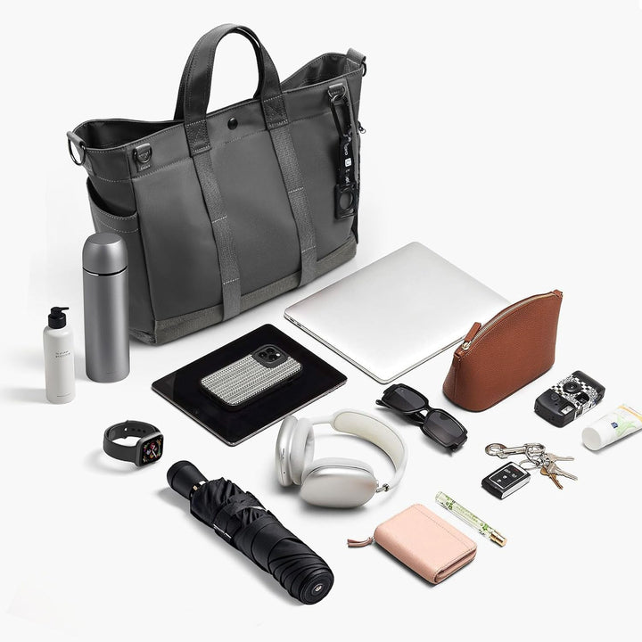 Stylish women's multi-compartment laptop tote, organized for professional use.