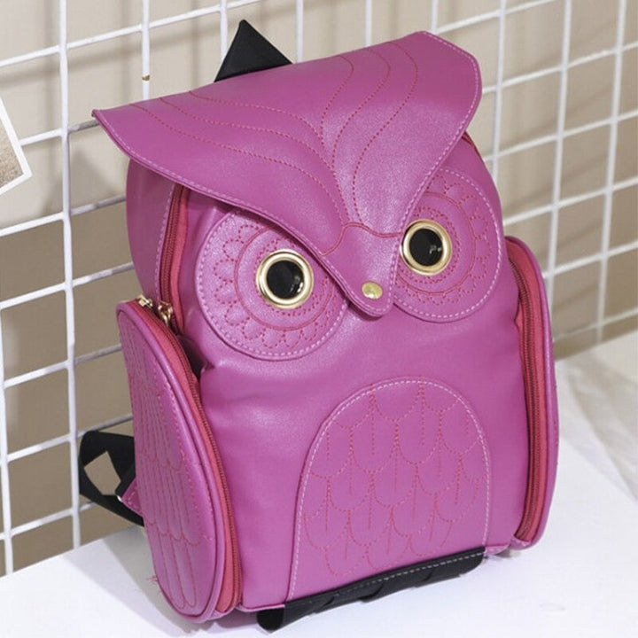 Side view: Multi-pocket women's PU leather owl print backpack, highlighting spacious compartments.