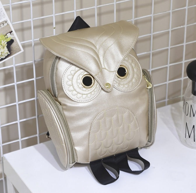 Close-up: Detail of the unique owl print on this chic PU leather multi-pocket women's backpack.
