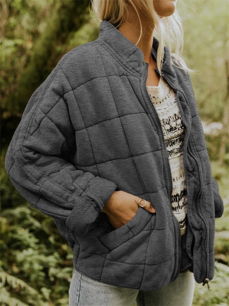Women's quilted lightweight zip-up jacket in black, ideal for fall & spring casual wear.