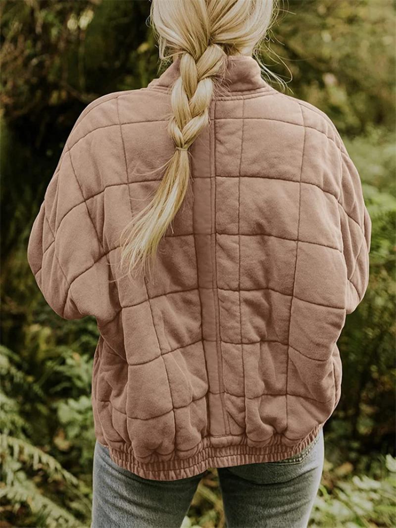 Sleek women's zip-up quilted jacket, a must-have for a fashionable and casual look.