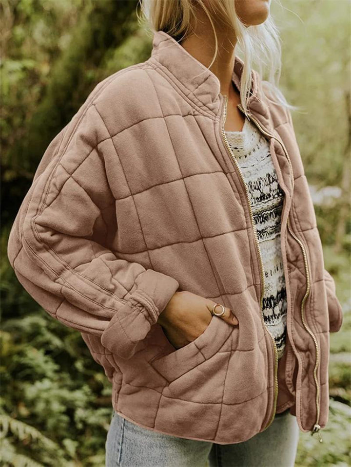 Casual women's zip-up quilted jacket, a versatile and stylish addition to any wardrobe.