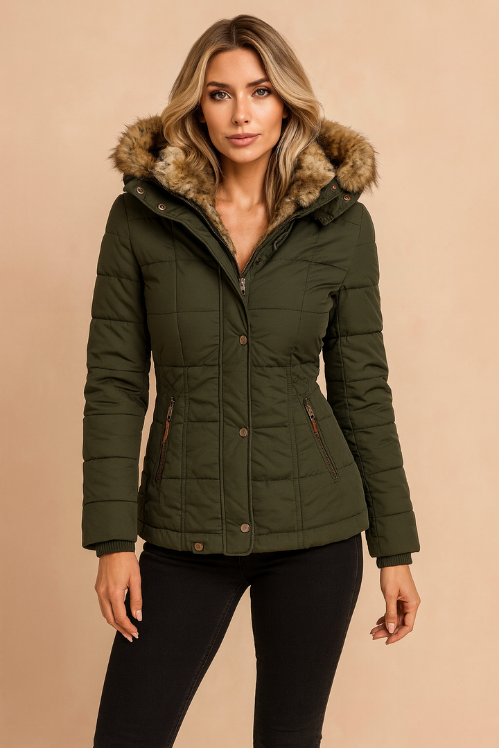 Fitted women's puffer jacket with hood. Quilted, insulated design provides ultimate warmth for winter outdoor wear.