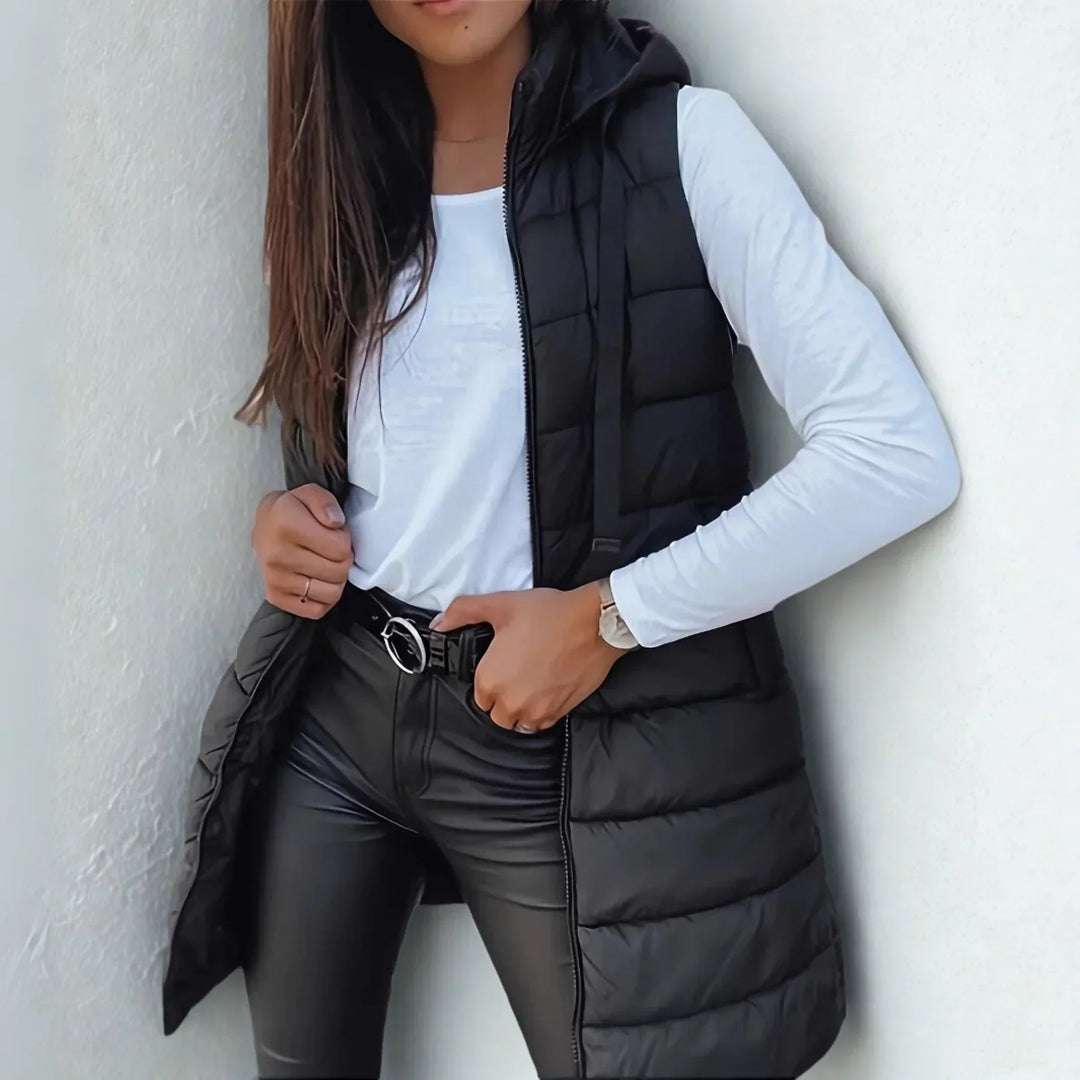 Women's Raine hooded long puffer vest in black, a stylish and warm sleeveless winter jacket.