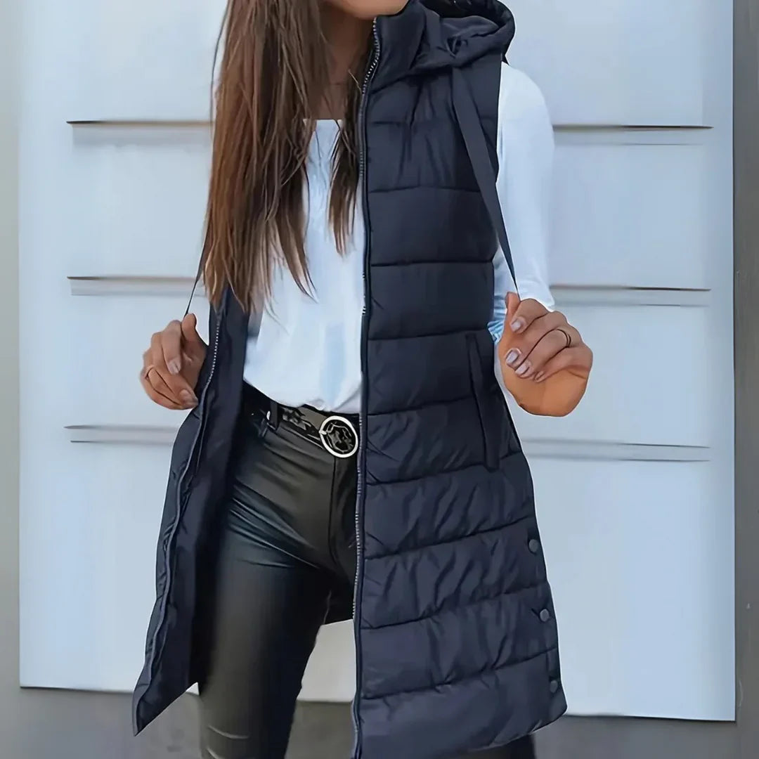 Black long hooded puffer vest, Raine style for women's modern casual outerwear.