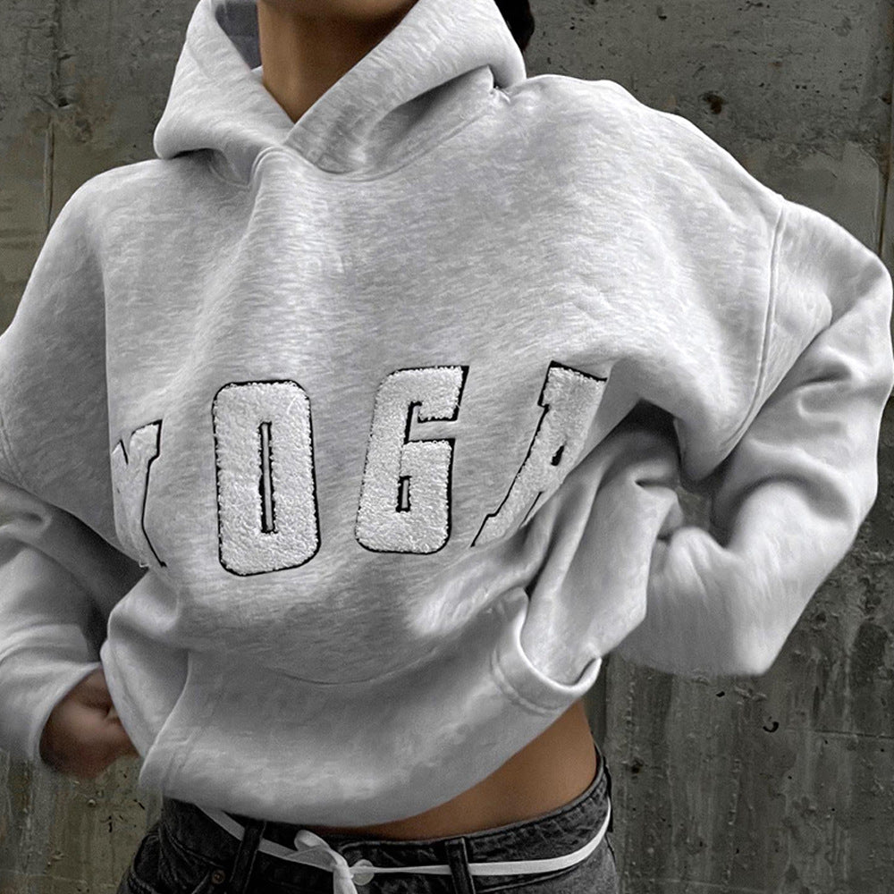 Women's relaxed fit athletic sweatshirt with 'Yoga' print, ideal for loungewear & activewear.