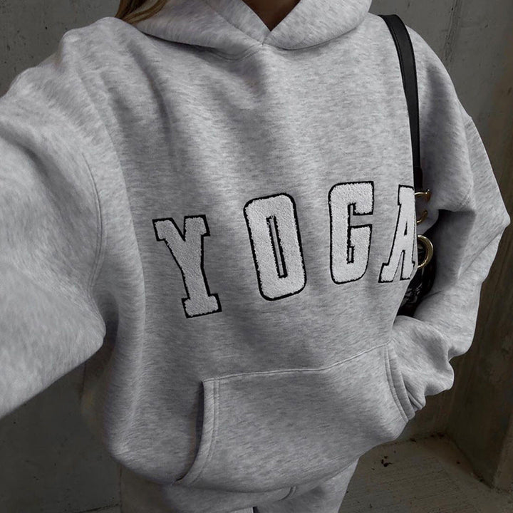 Soft women's casual oversized sweatshirt featuring yoga print, ideal for winter comfort & everyday.