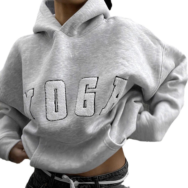 Relaxed fit women's activewear sweatshirt with inspiring yoga print, suitable for workouts & comfort.