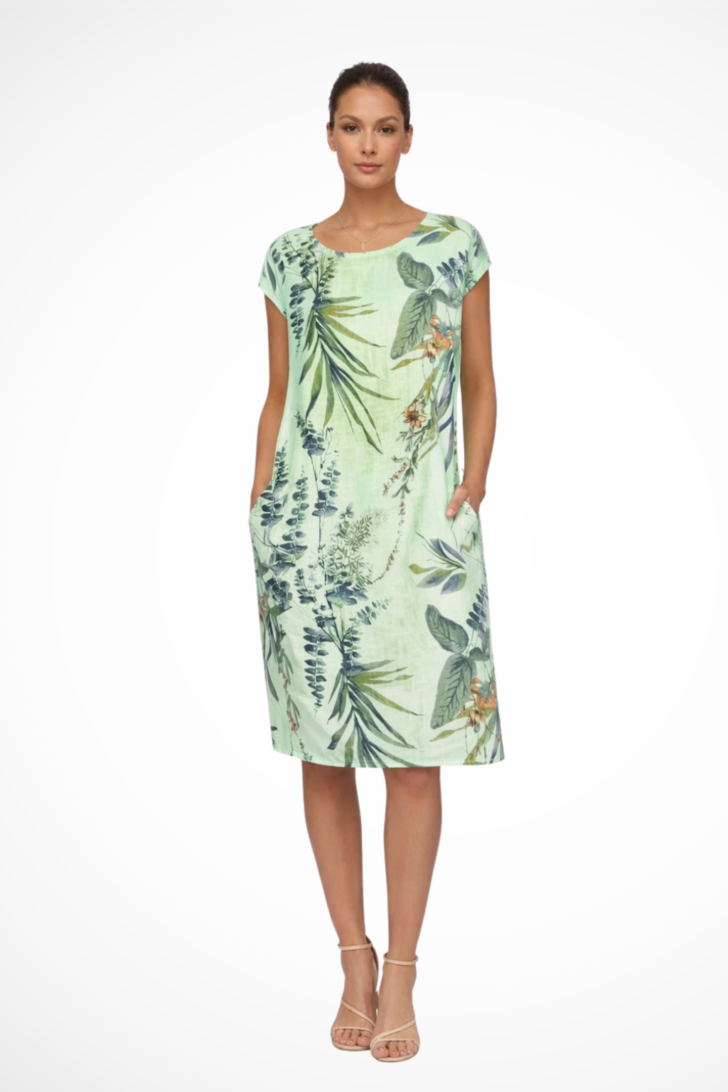 Women's casual summer shift dress with beautiful botanical print and convenient pockets.