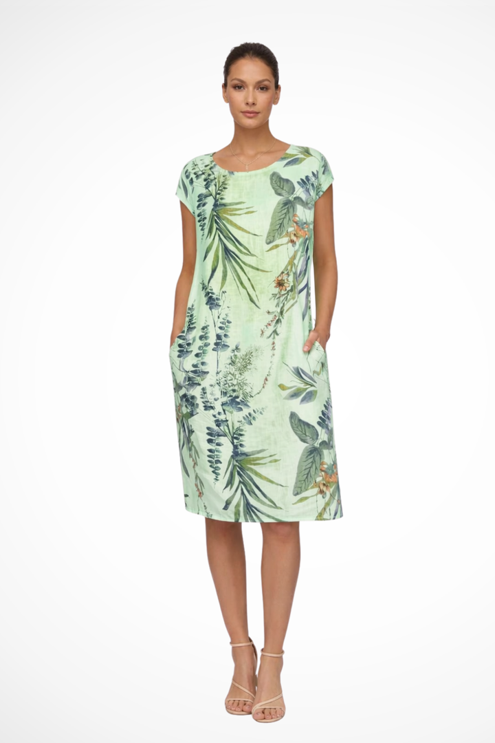 Women's casual summer shift dress with beautiful botanical print and convenient pockets.