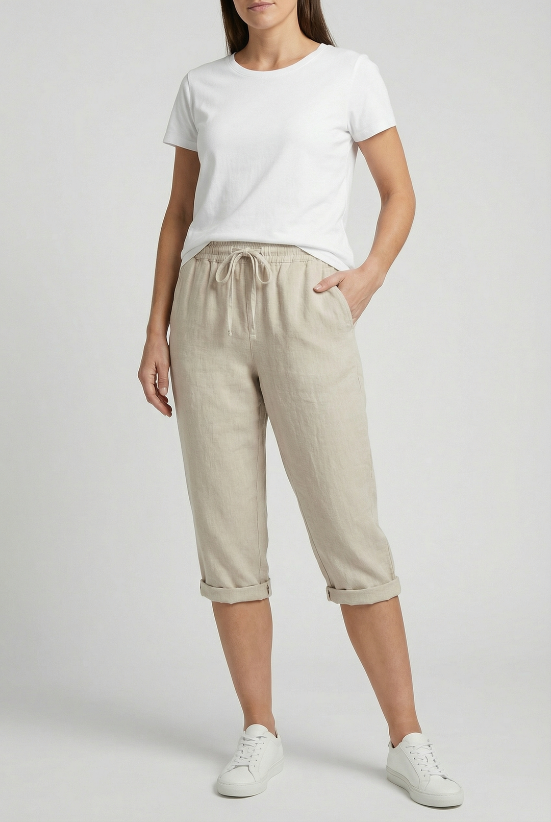 Women's relaxed fit capri pants with elastic waist & pockets for comfortable everyday wear.