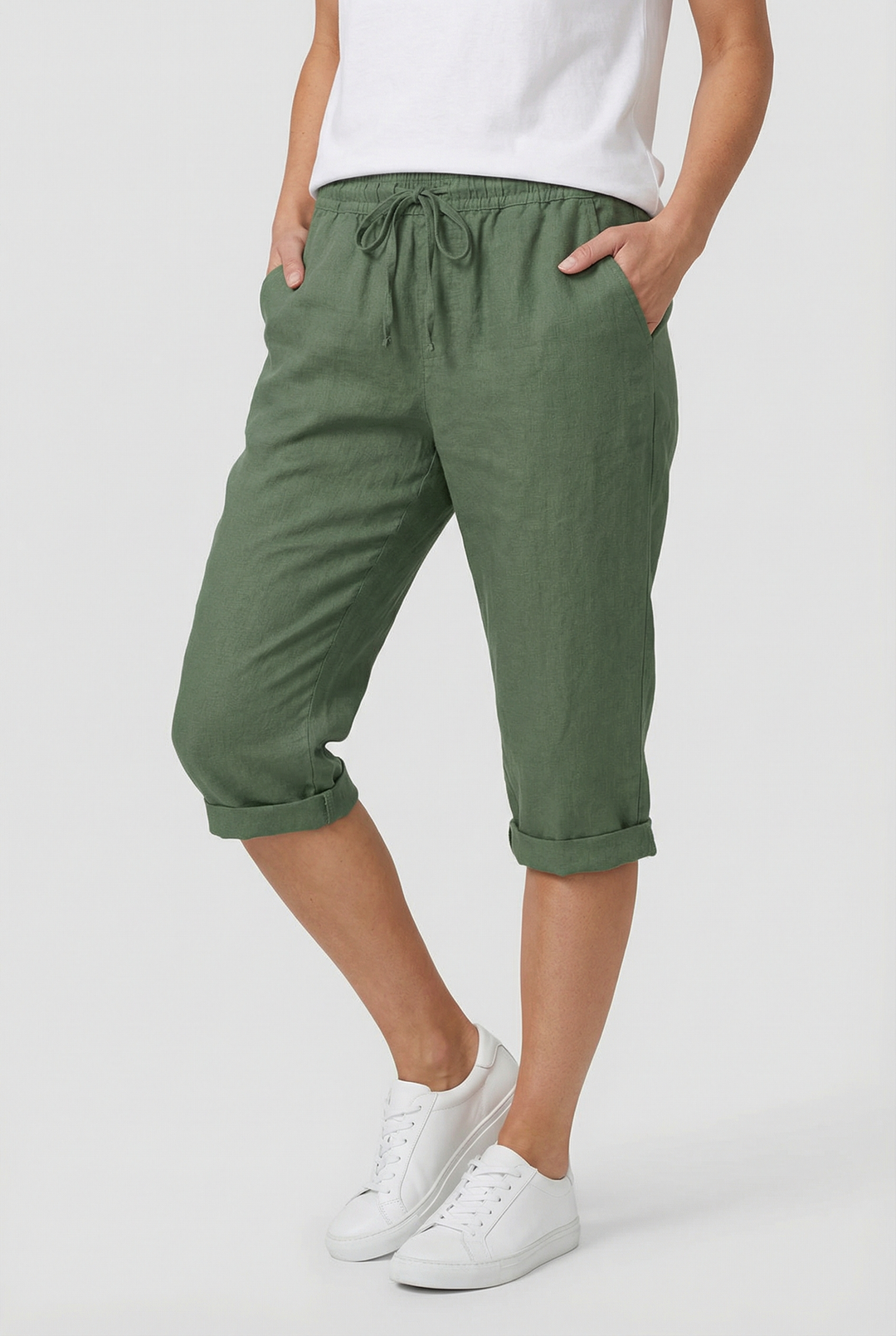 Women's relaxed fit capri pants with elastic waist, deep pockets, and a comfortable cropped design.