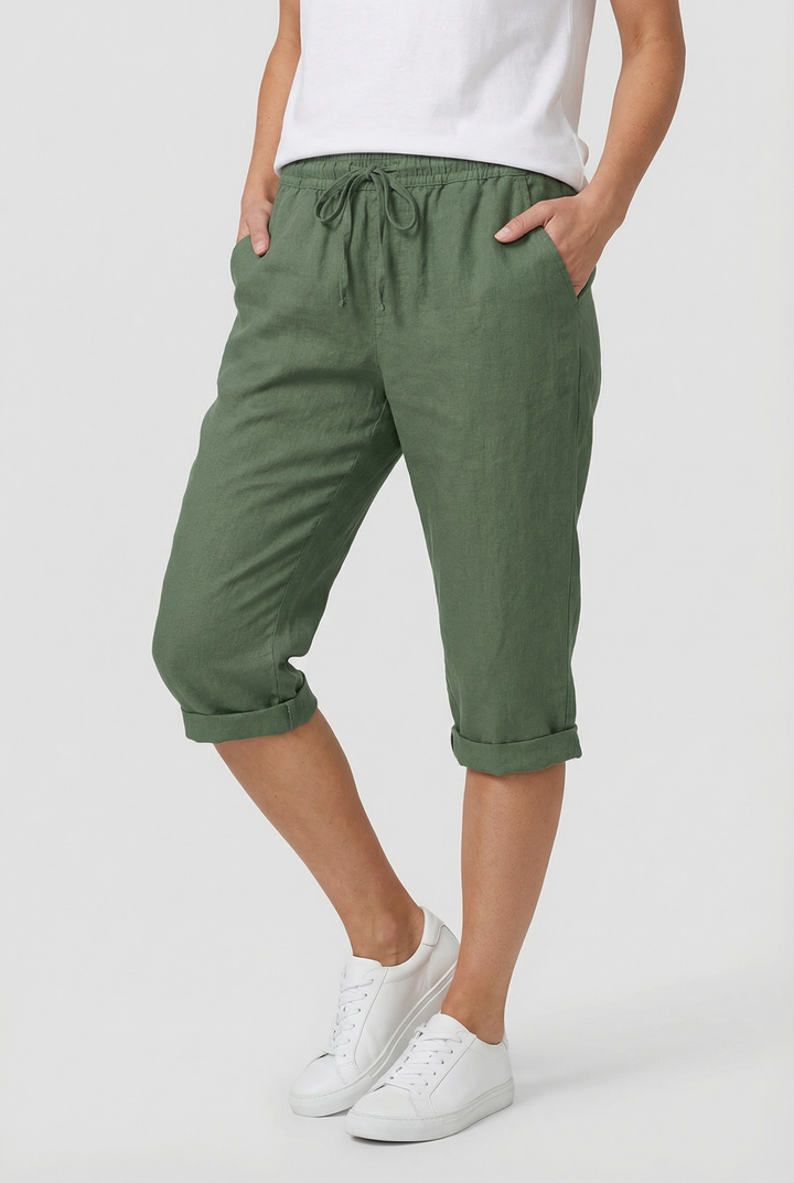 Women's relaxed fit capri pants with elastic waist, deep pockets, and a comfortable cropped design.