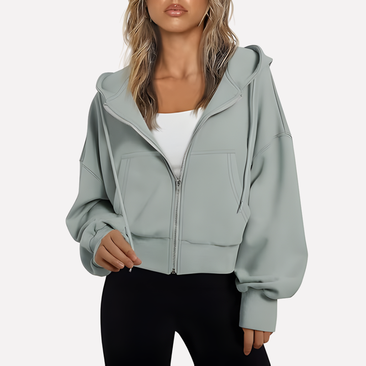 Casual women's cropped drawstring hoodie. Relaxed fit with a full zipper, a must-have for modern wardrobes.