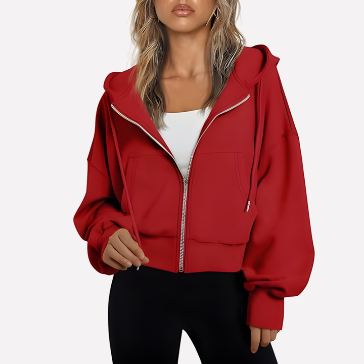 Women's relaxed fit cropped zip jacket. Stylish drawstring hoodie designed for comfortable everyday fashion.