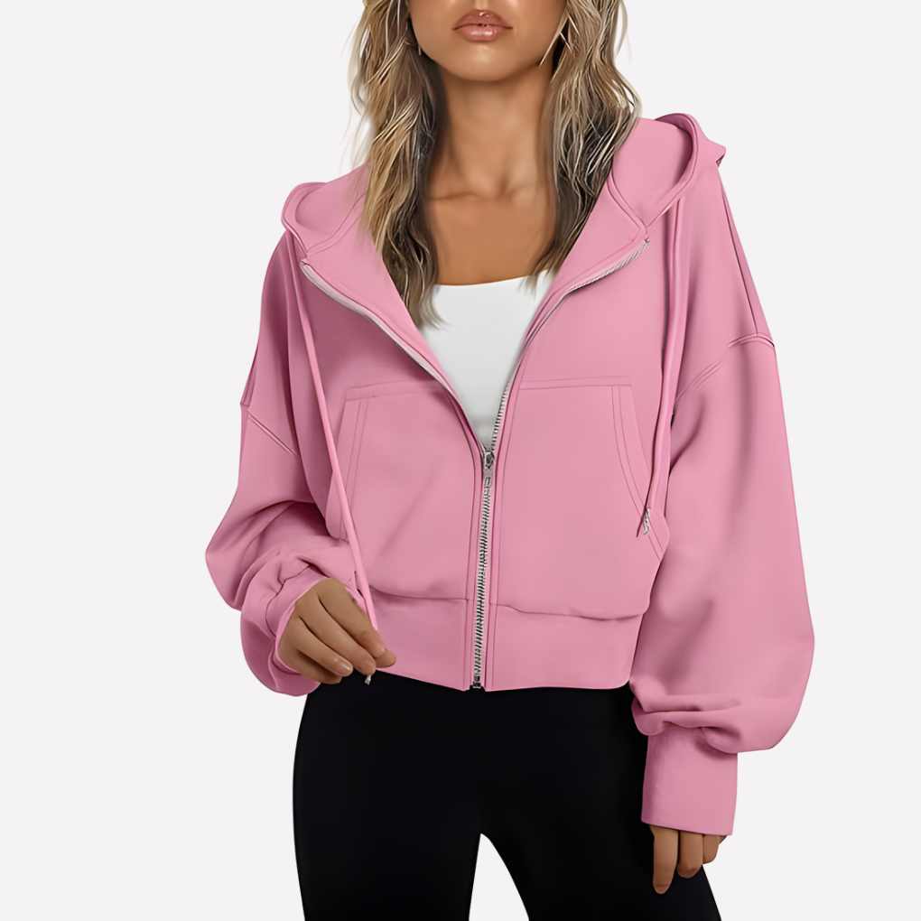 Trendy women's cropped zip hoodie. Relaxed style and drawstring detail for a fashionable casual look.