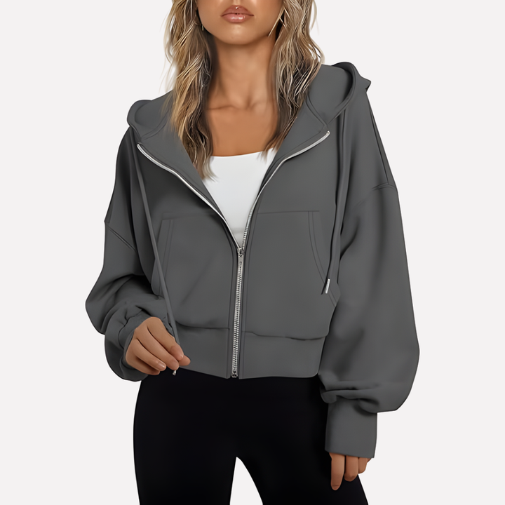 Modern casual women's cropped zip hoodie. Relaxed fit and drawstring for a versatile and fashionable statement.