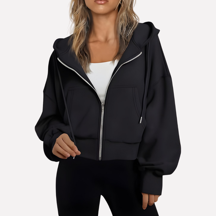 Modern women's cropped zip-up jacket. Relaxed fit and stylish drawstring design for versatile fashion.