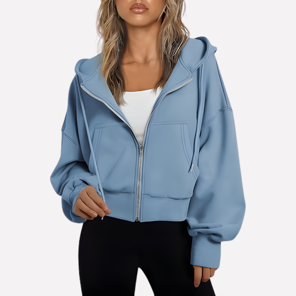 Casual women's drawstring hoodie. Features a relaxed fit, cropped length, and convenient front zipper.