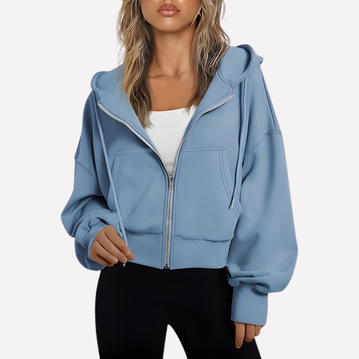 Casual women's drawstring hoodie. Features a relaxed fit, cropped length, and convenient front zipper.