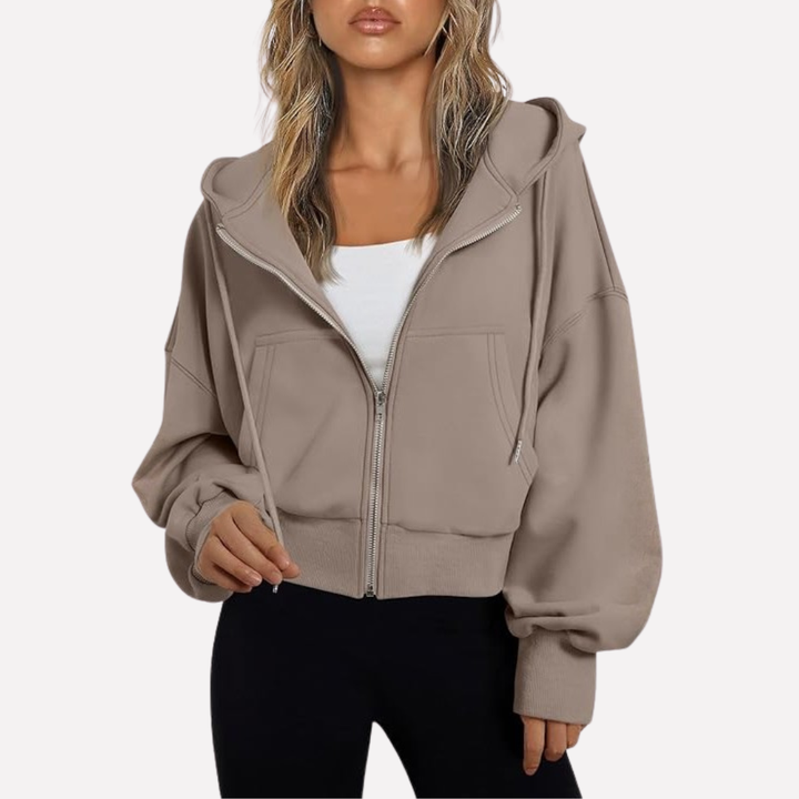 Versatile women's cropped zip hoodie, relaxed style. Ideal for modern casual wear and everyday comfort.