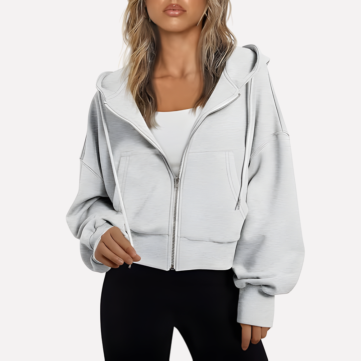Everyday women's cropped hoodie, relaxed fit. Features a full zip and adjustable drawstring for comfort.