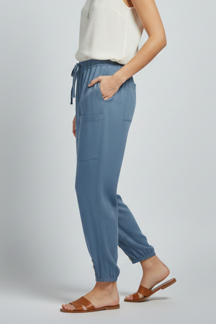 Casual women's straight leg trousers featuring a comfortable drawstring waist and stylish button hem.
