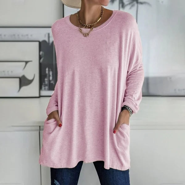 Close-up of the soft fabric texture of a women's relaxed fit long sleeve casual top.