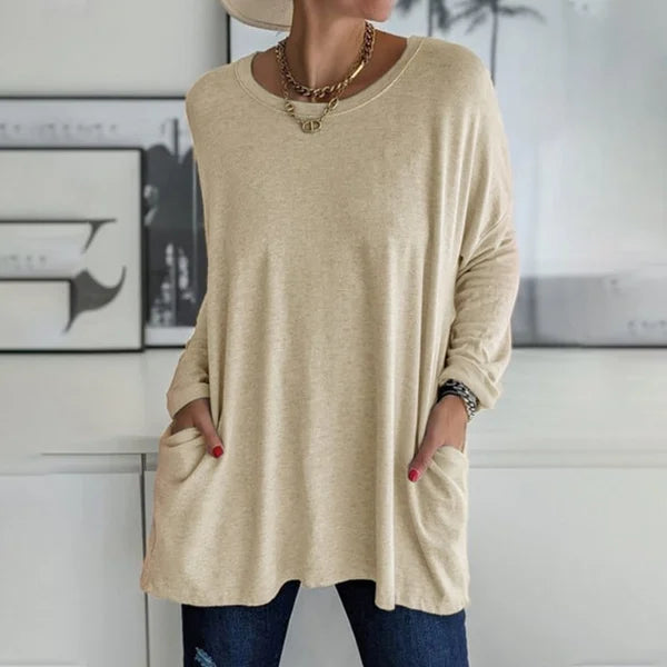 Woman wearing a relaxed fit long sleeve casual top, demonstrating its comfortable drape.