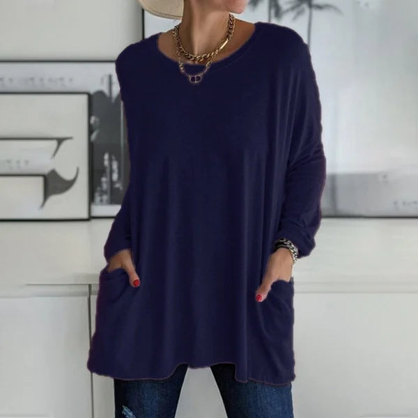 Back view of a women's relaxed fit long sleeve casual top, showing its loose silhouette.