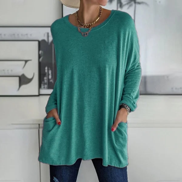Women's relaxed fit long sleeve top in a vibrant blue color, a great addition to casual wardrobe.