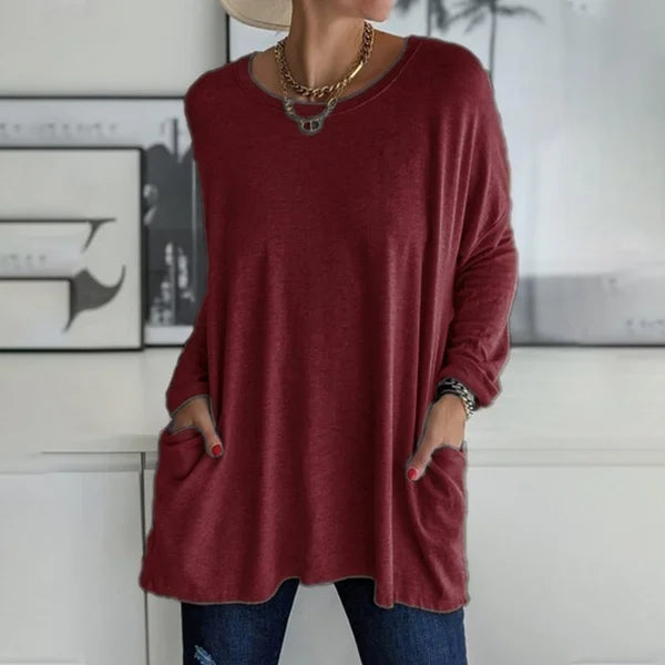 Front view of a simple yet elegant women's relaxed fit long sleeve top, perfect for layering.