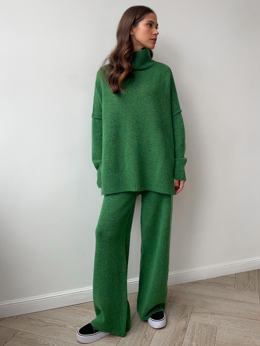 Model enjoying coffee in a casual chic women's spring summer lounge set with a relaxed fit.
