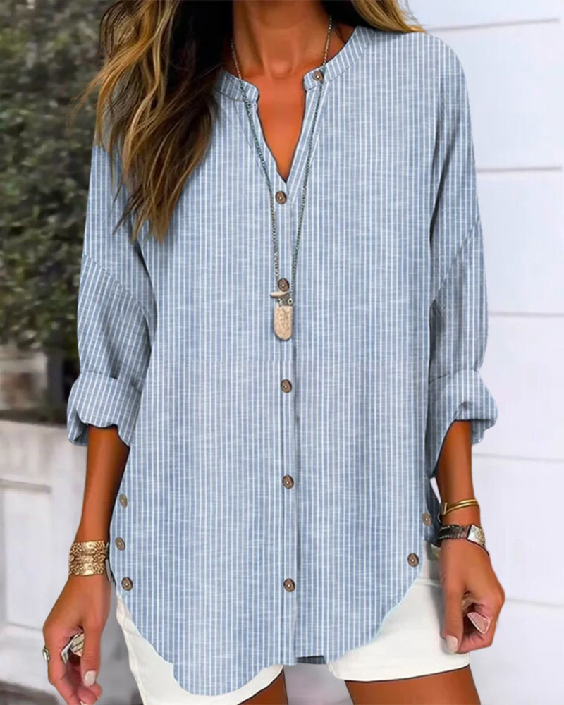 Fashionable women's striped button-up blouse with a relaxed silhouette, suitable for everyday tops.