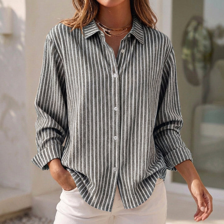 Comfortable women's striped relaxed-fit summer blouse, a stylish long-sleeve button-down top.