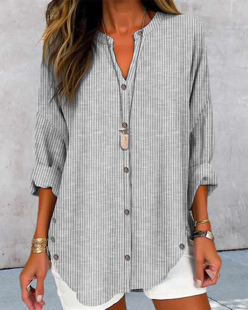 Summer casual women's striped blouse with a relaxed silhouette and button details.
