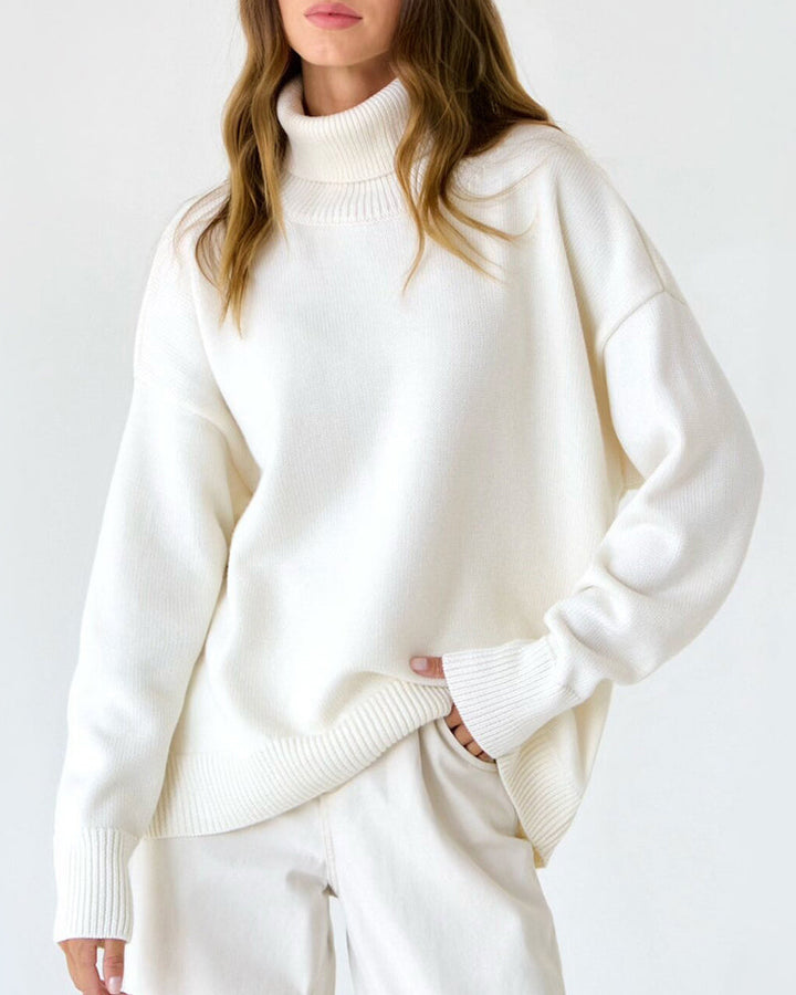 Women's relaxed fit turtleneck sweater in soft pink, perfect for spring casual wear