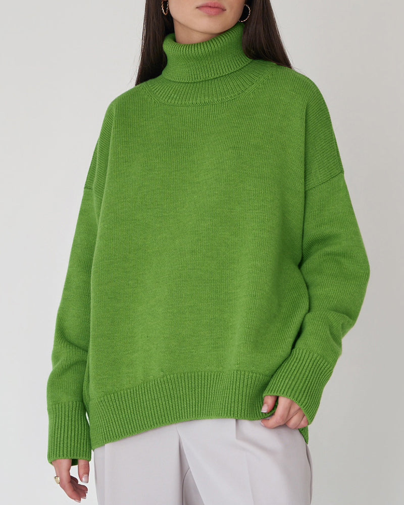Fashionable women's relaxed turtleneck sweater in a vibrant blue, a spring wardrobe staple