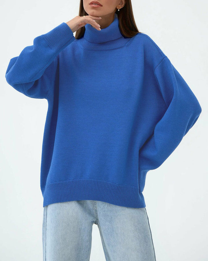 Detail of the soft knit fabric of a women's relaxed fit turtleneck spring sweater