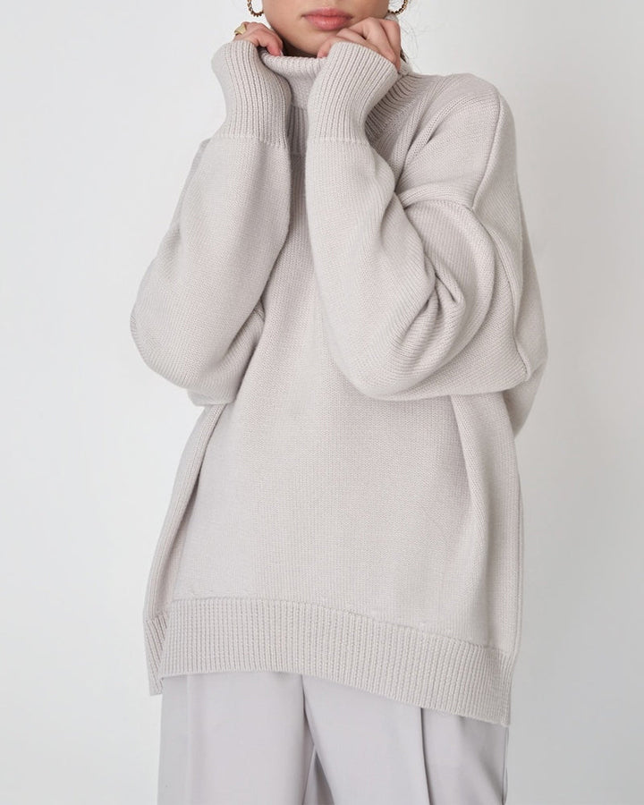 Women's relaxed fit long sleeve turtleneck sweater in a beige shade, suitable for spring