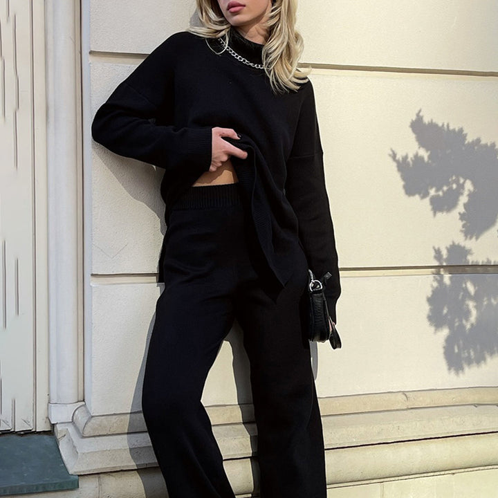 Cozy women's relaxed fit turtleneck sweater. Chic long sleeve top with modern side splits, ideal for autumn.