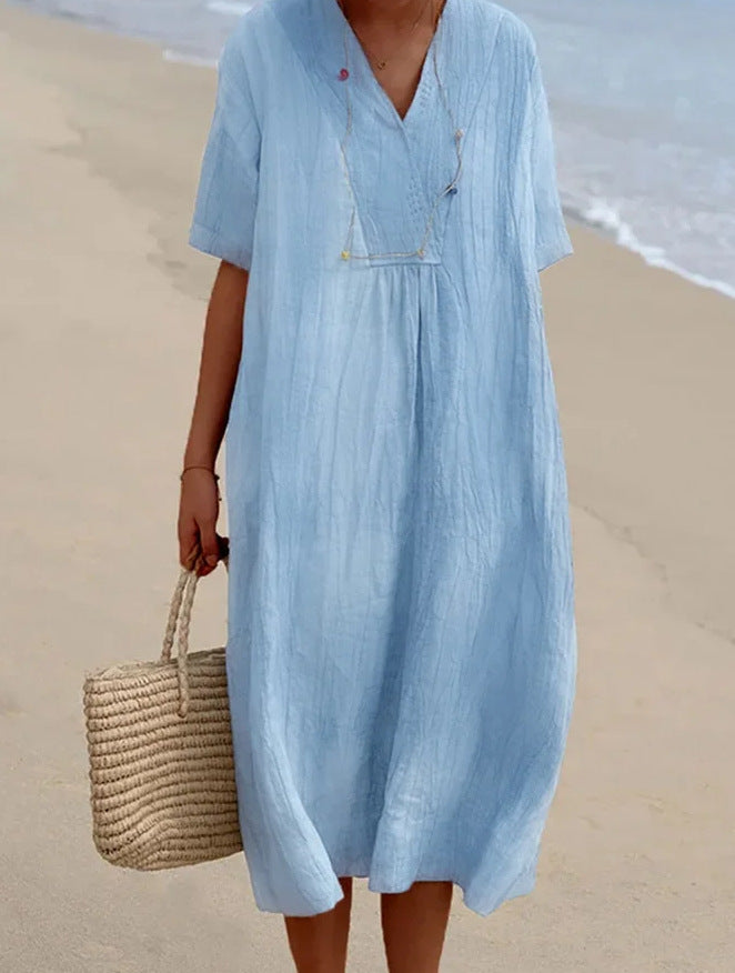 Stylish women's relaxed V-neck beach dress, short sleeve, light fabric, essential summer resort wear