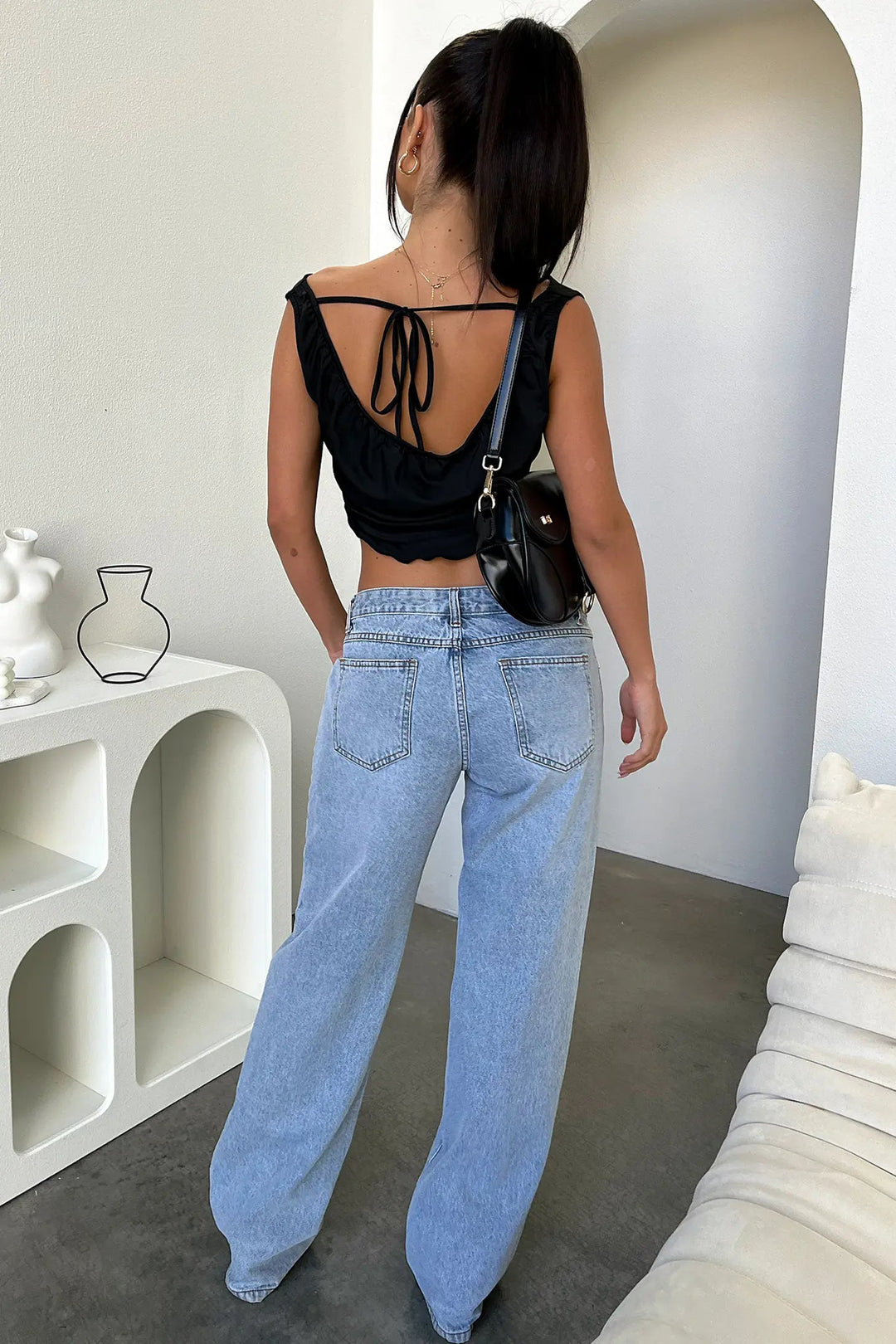 Stylish women's blue denim jeans with a relaxed straight-leg fit, great for spring outfits
